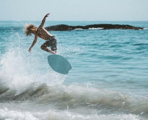 what is skimboarding